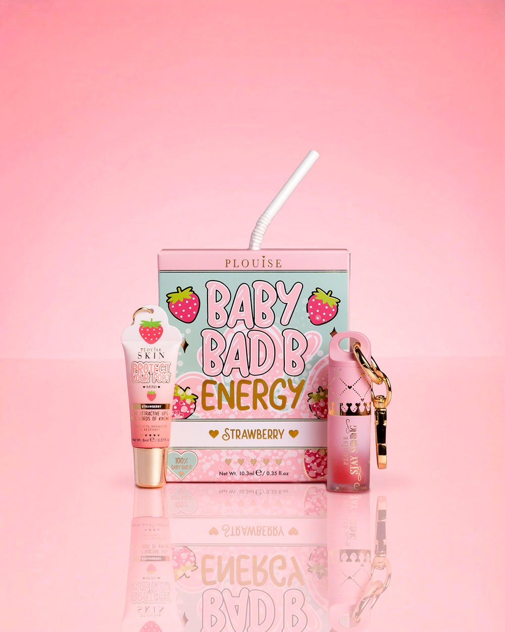 P.Louise Strawberry Baby Bad B Mini olejek do ust i mini odżywka do ust na różowym tle