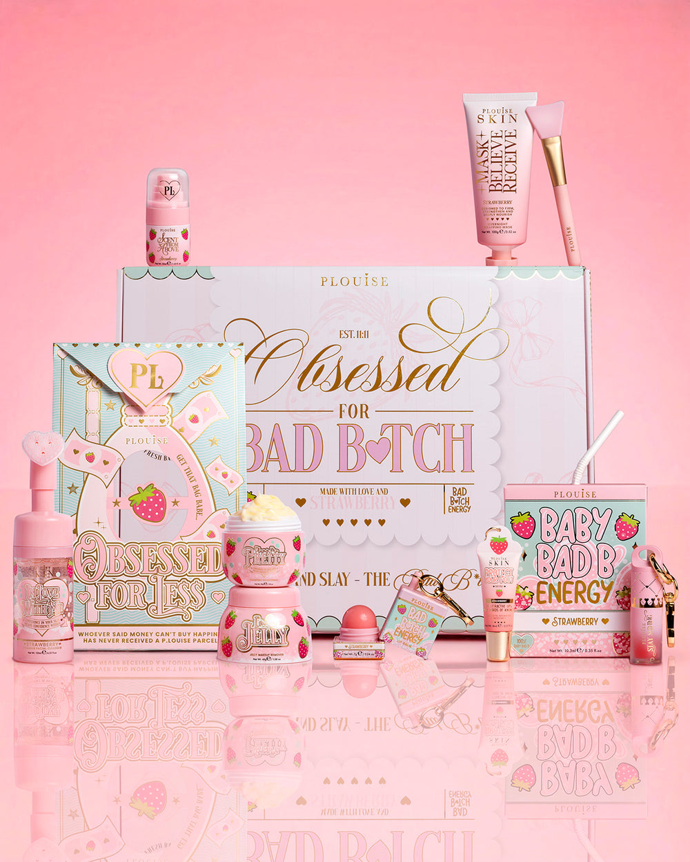 Produkty P.Louise Strawberry Obsessed For Bad Bitch otaczają opakowanie na różowym tle