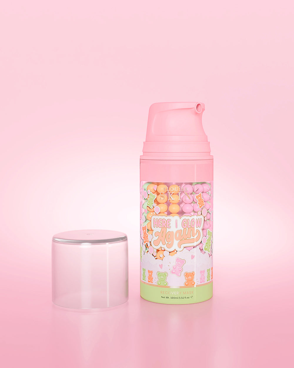 Fioletowa butelka P. Louise Here I Glow Again Candy Bears Recovery Mask na różowym tle