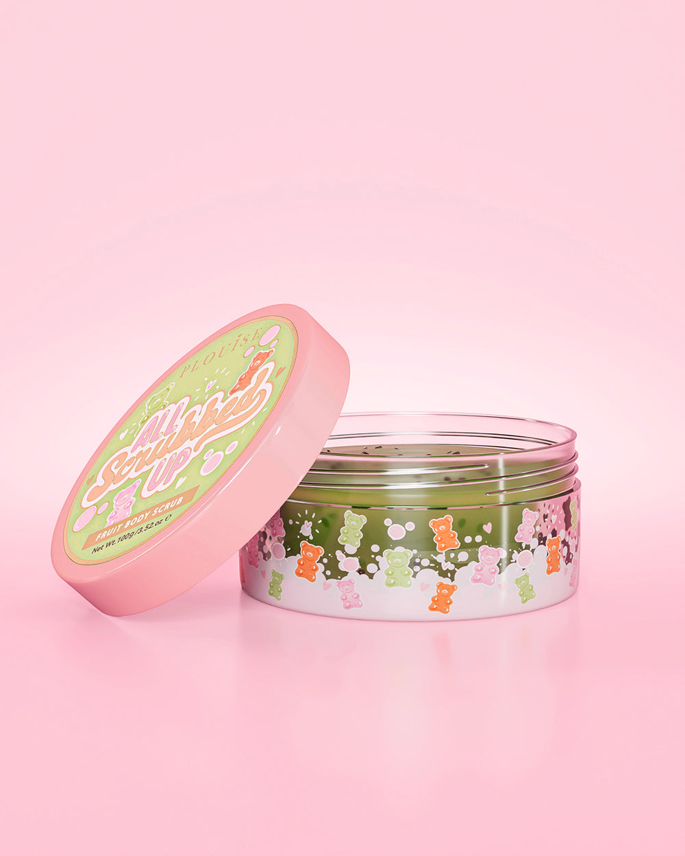 Otwórz słoiczek P. Louise All Scruished Up Body Scrub o zapachu Gummy Bears na różowym tle